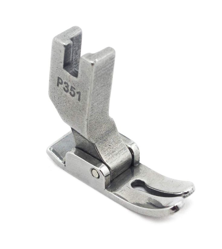 Close-up photograph of a sewing machine presser foot pressing down on the needle plate